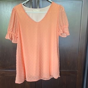 Beautiful peach colored dressy top. NWOT, never worn. Raised dots. Size L